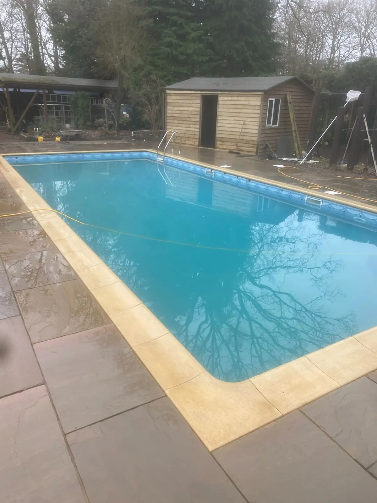 Sandstone paving around an outdoor swimming pool