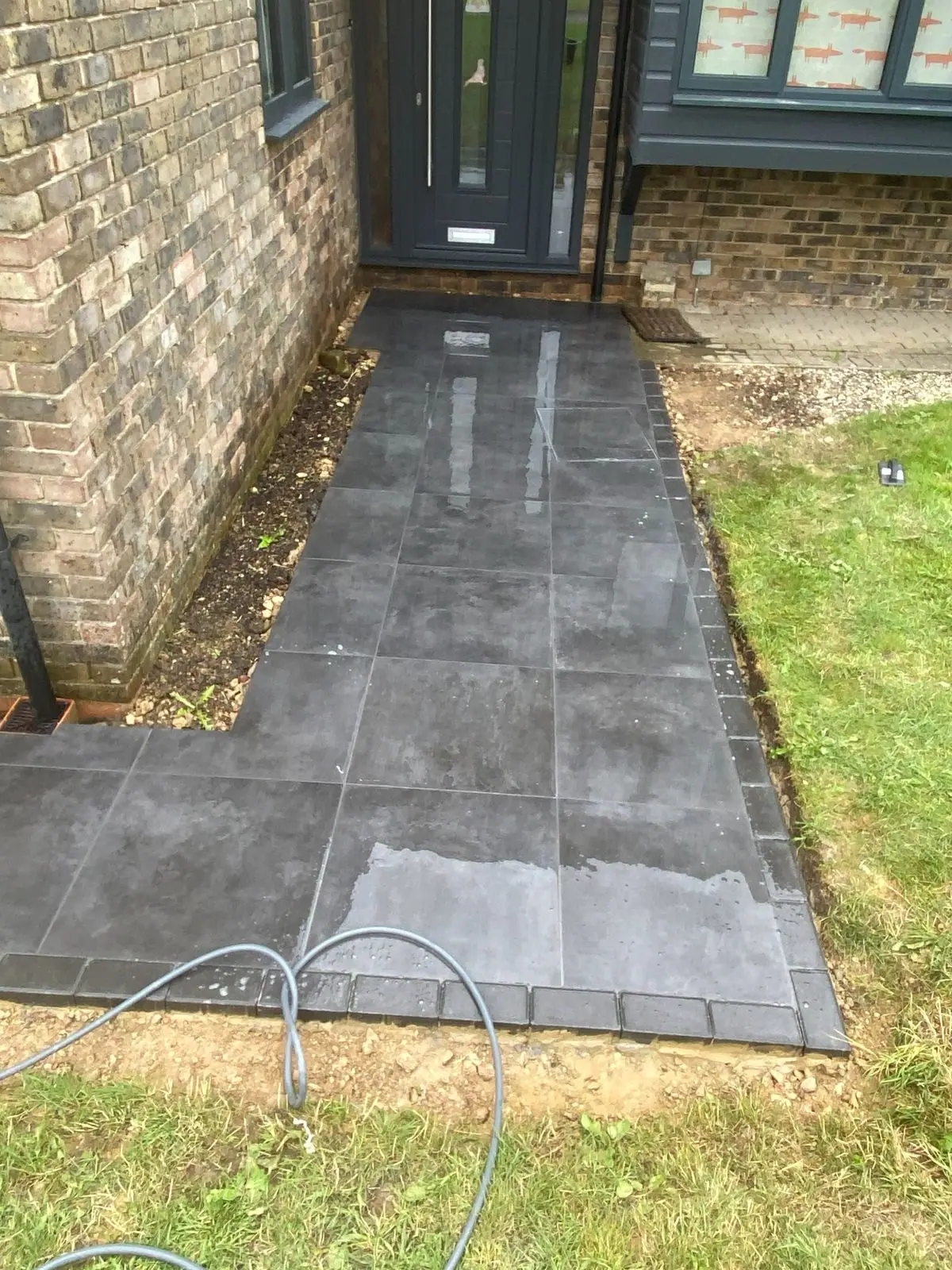 Porcelain path along the front of the house