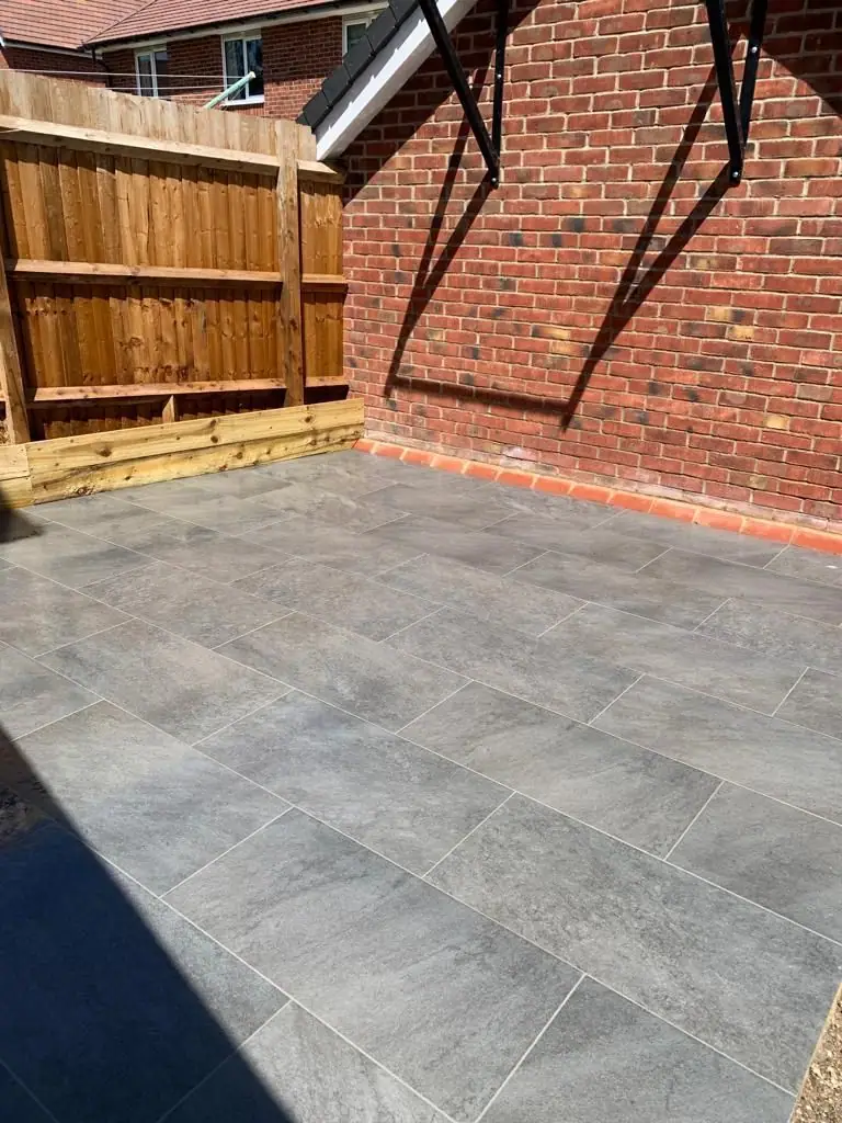 Porcelain patio along the side of the house