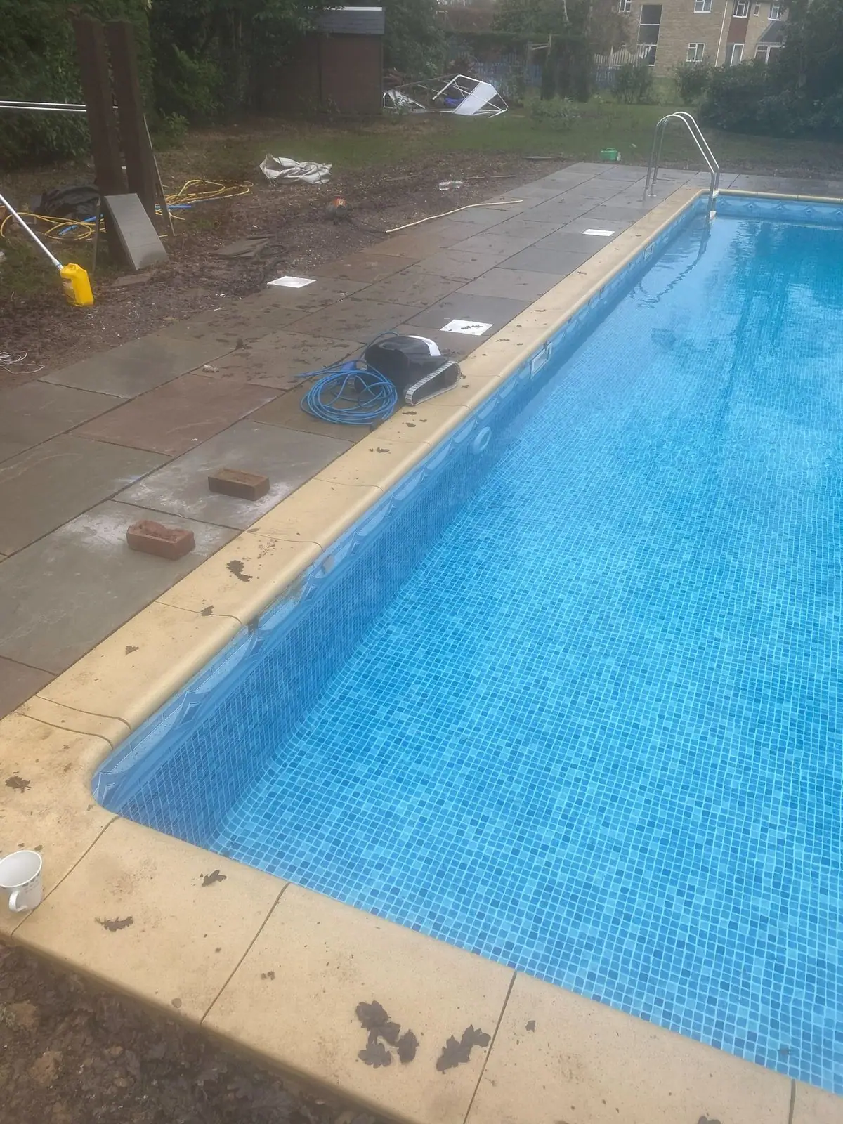 Sandstone coping along the edge of the pool