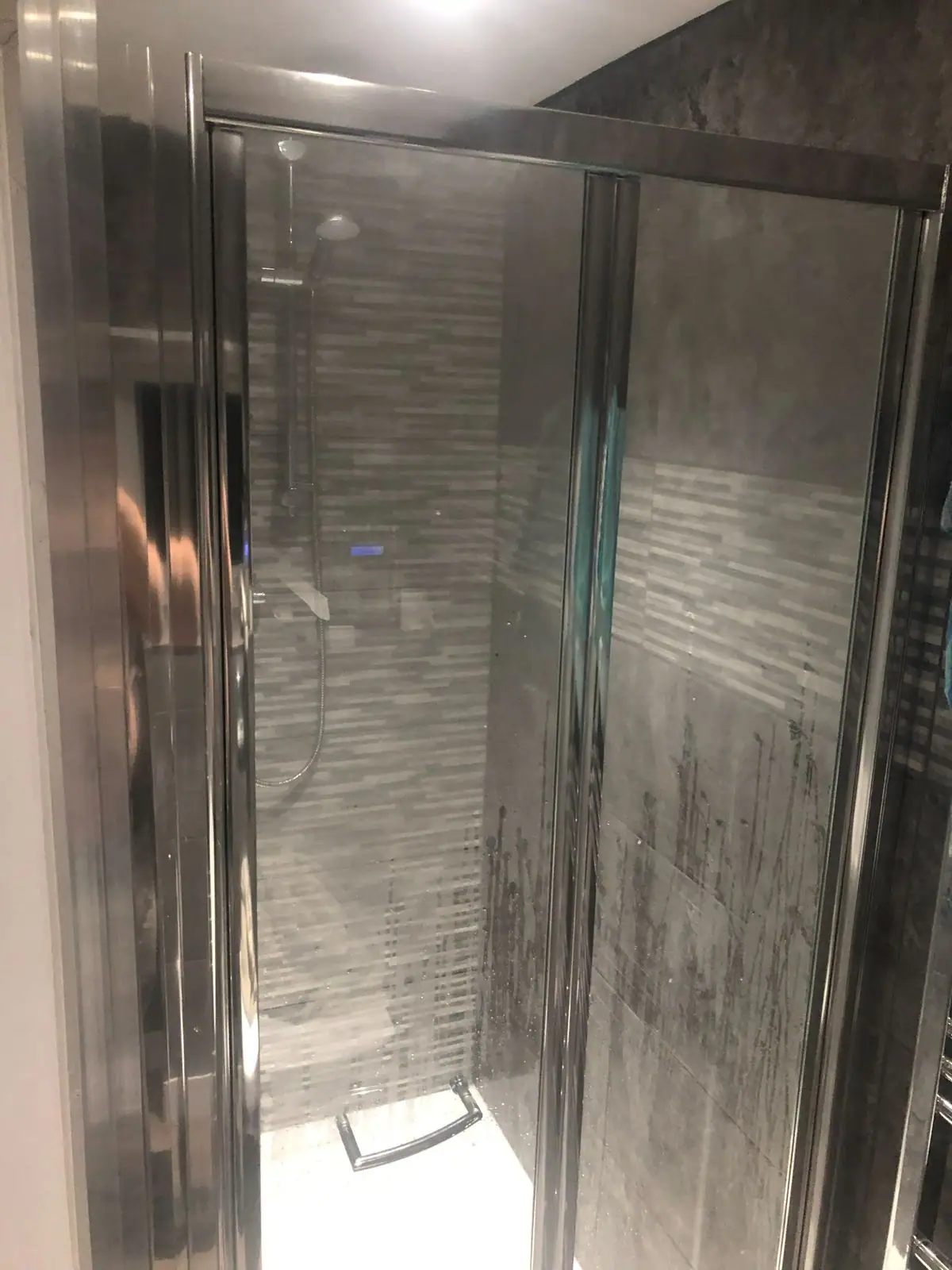 Shower enclosure with chrome frame