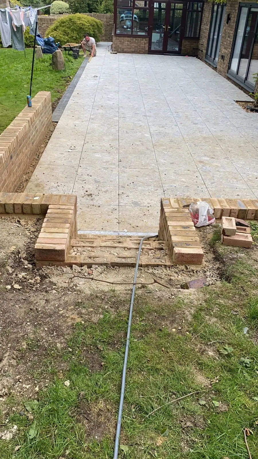 Brick steps down from the terrace