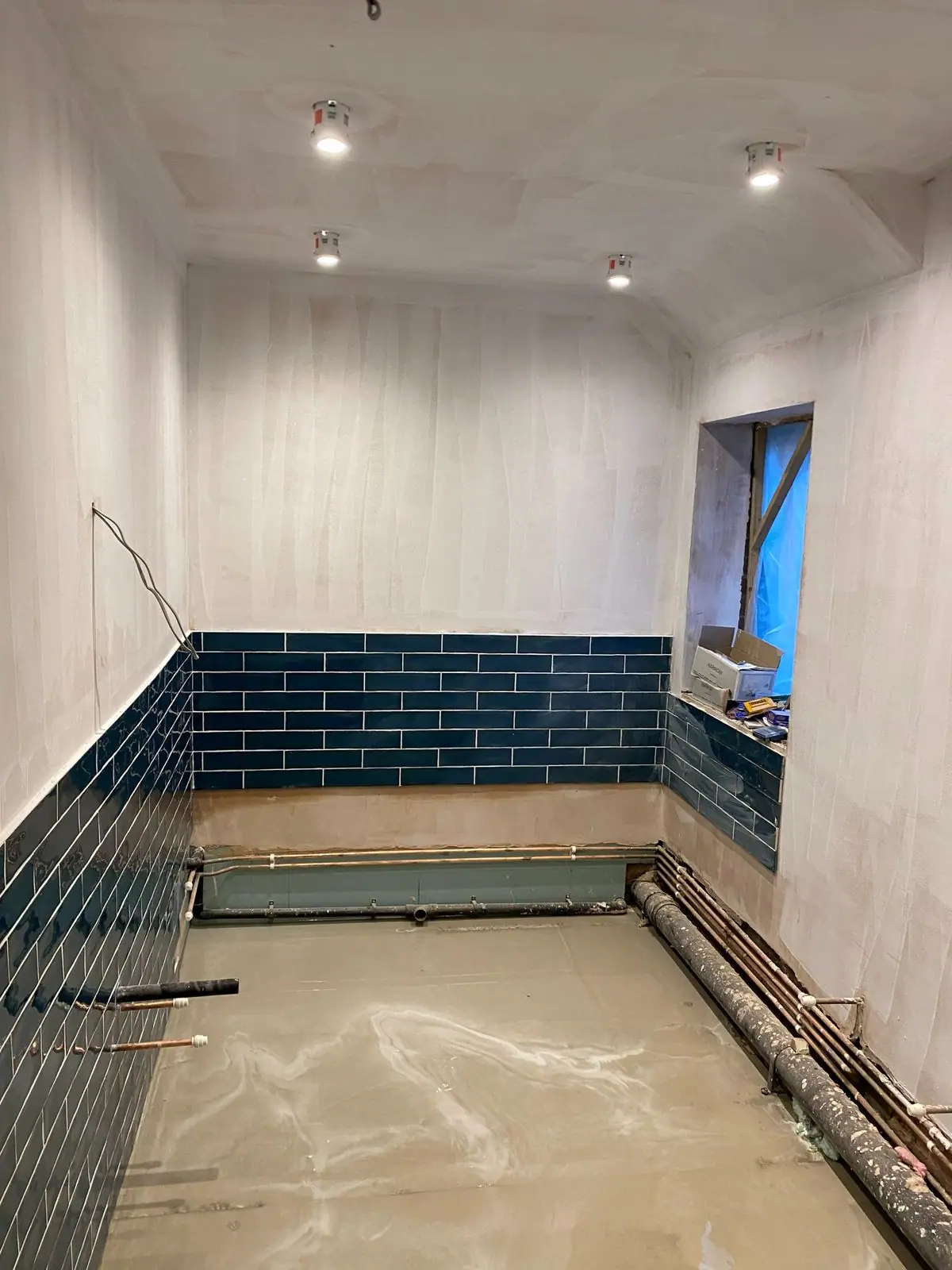 Teal metro tiles going on