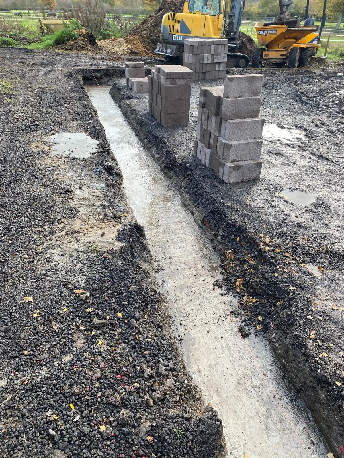 Concrete foundations poured in the trenches