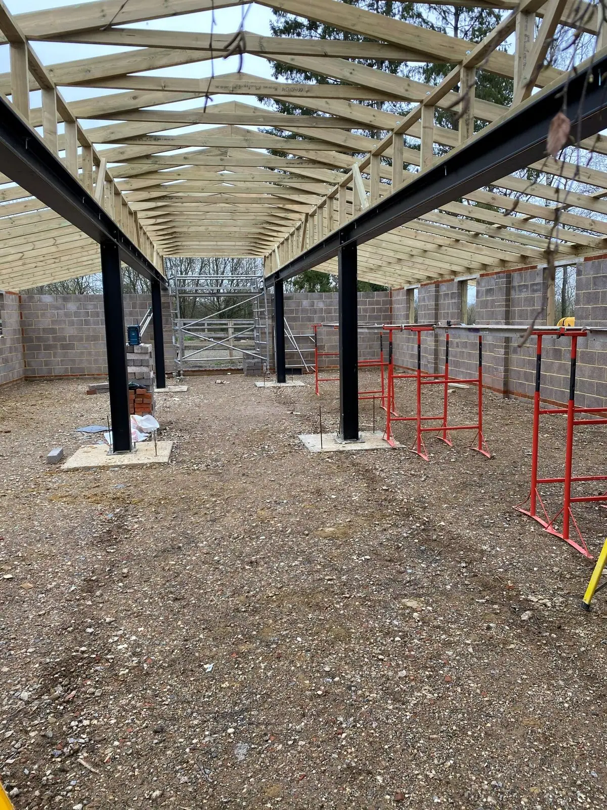 Steel frame and timber roof trusses in place