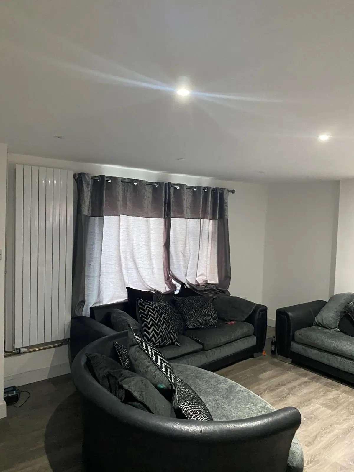 Living room with spotlights and radiator