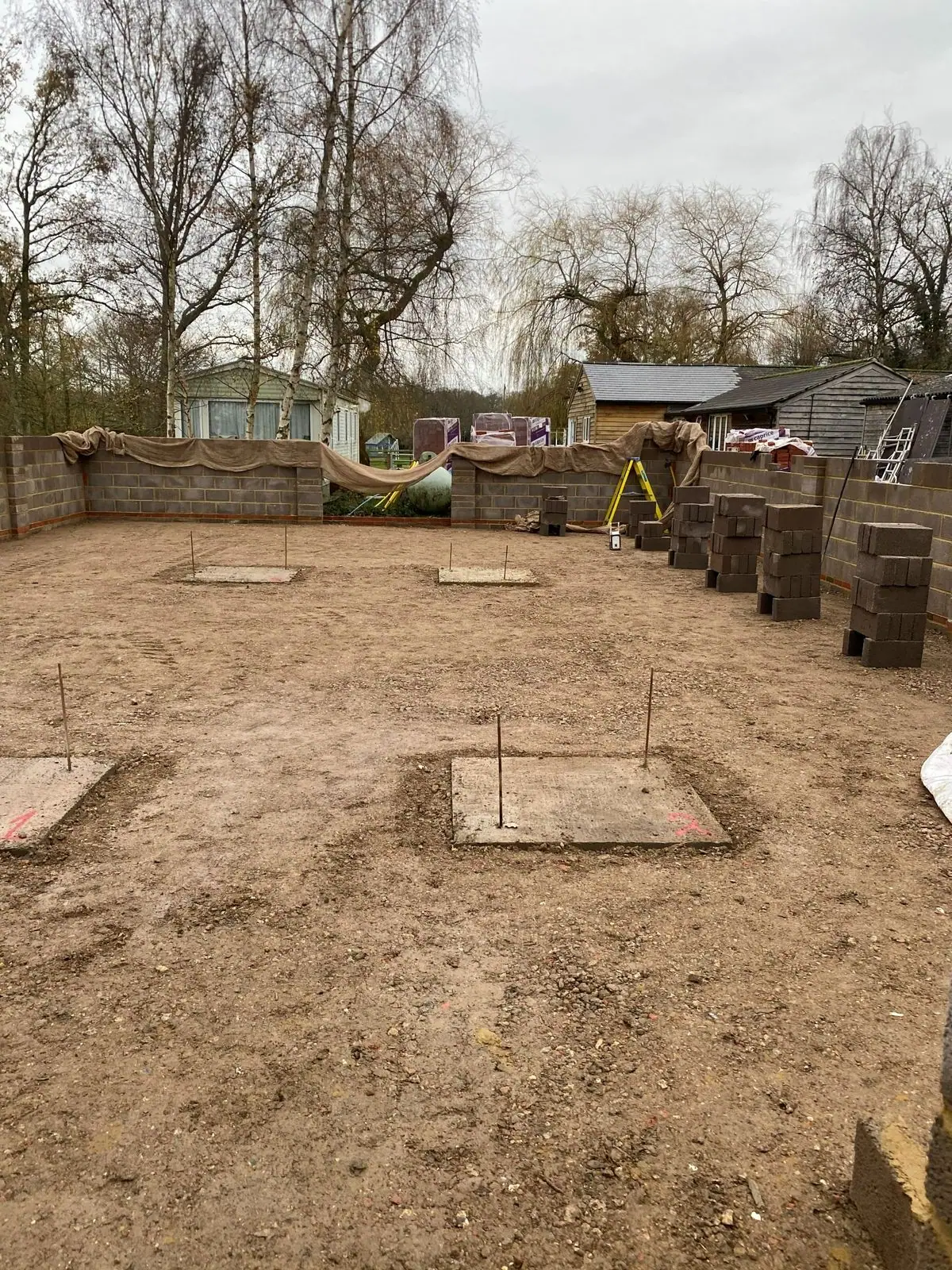 Blockwork walls rising on the foundations