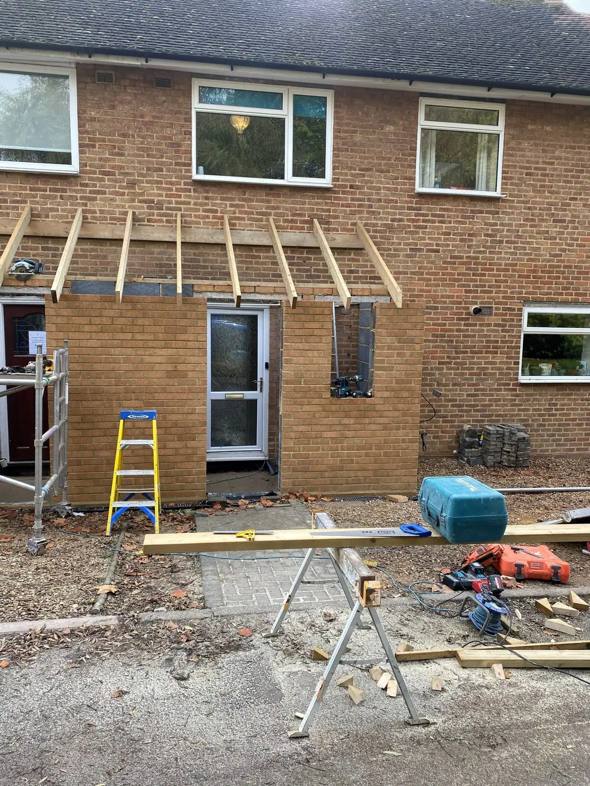 Front porch extension with new brickwork and roof timbers in progress